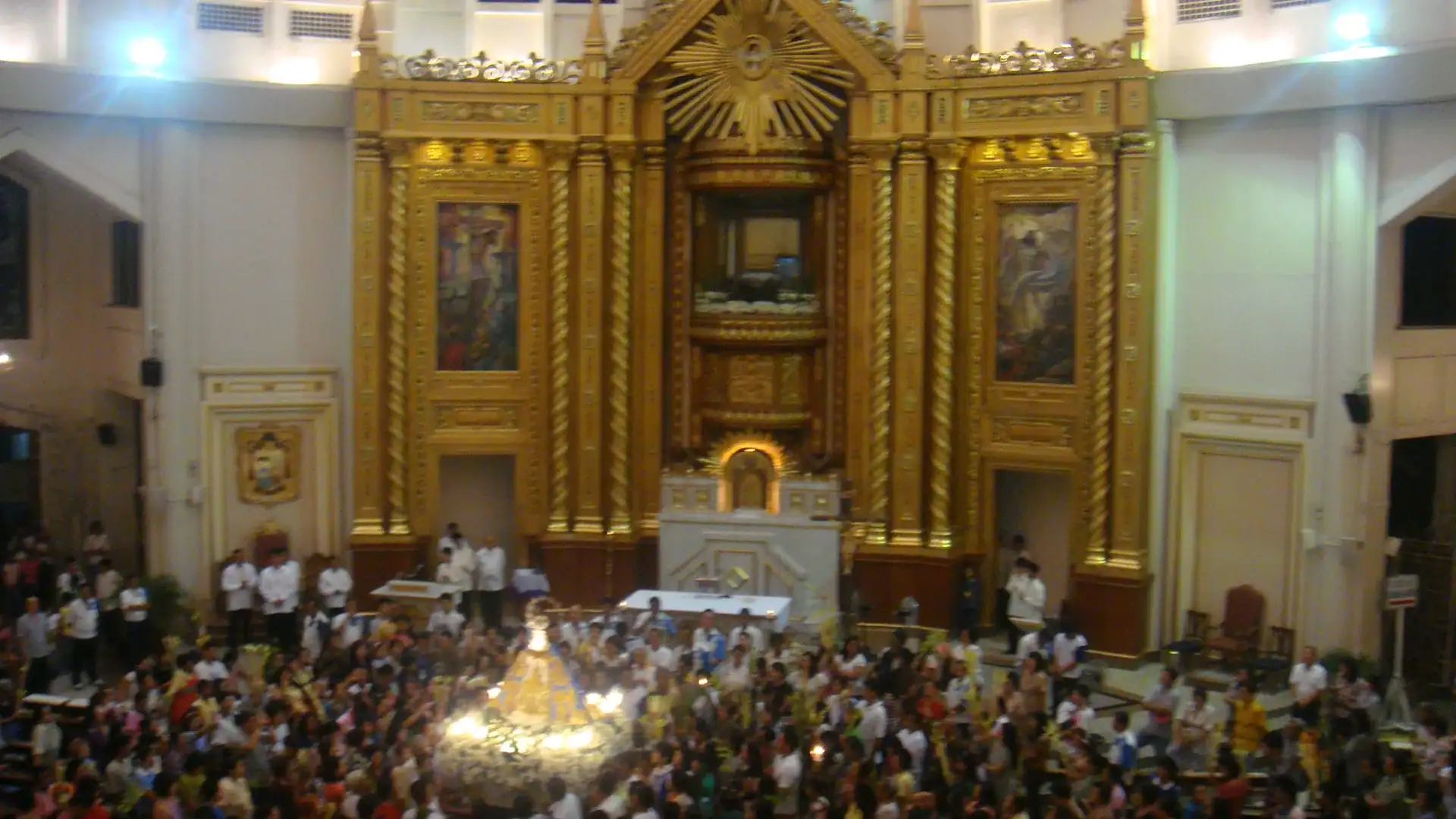 Pilgrims and the altar inside the Shrine of Our Lady of Peace and Good Voyage, Antipolo