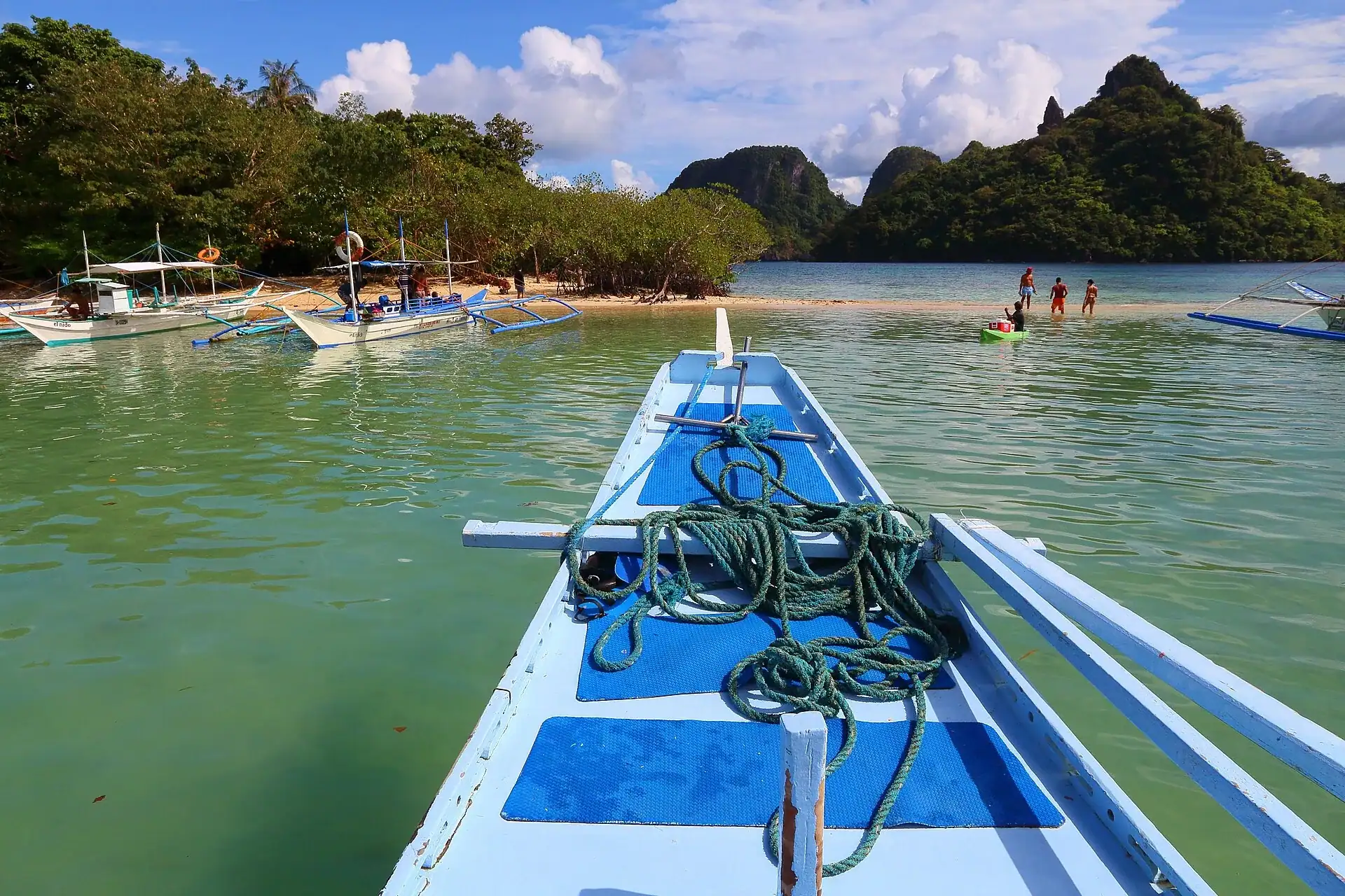 Island hopping boats at the Snake Island sandbar, Palawan